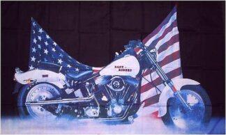 American flag-themed motorcycle with patriotic flags draped behind it, showcasing a bold display of national pride and motorcycle culture. Ideal for displaying USA pride at rallies or patriotic events.