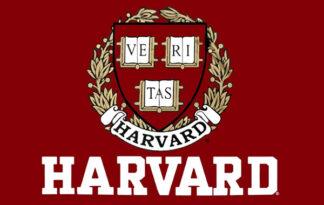 Harvard University shield logo with "Veritas" motto, featuring a red background and gold laurel wreath, representing academic excellence and tradition.